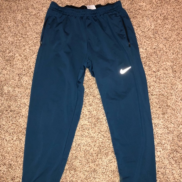 nike dri fit pants with zipper pockets